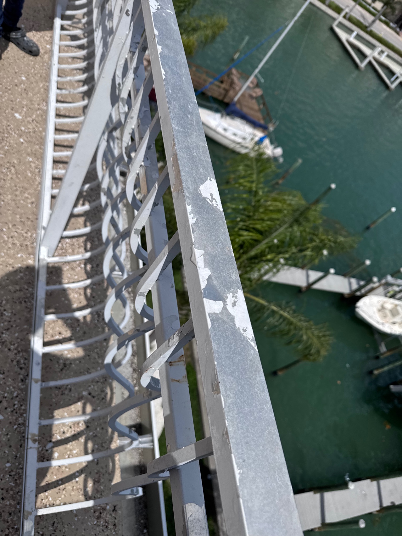 Waterfront Railing Restoration — Waterproofing & Specialty Coatings project by JDC Painting in Clearwater Beach, FL